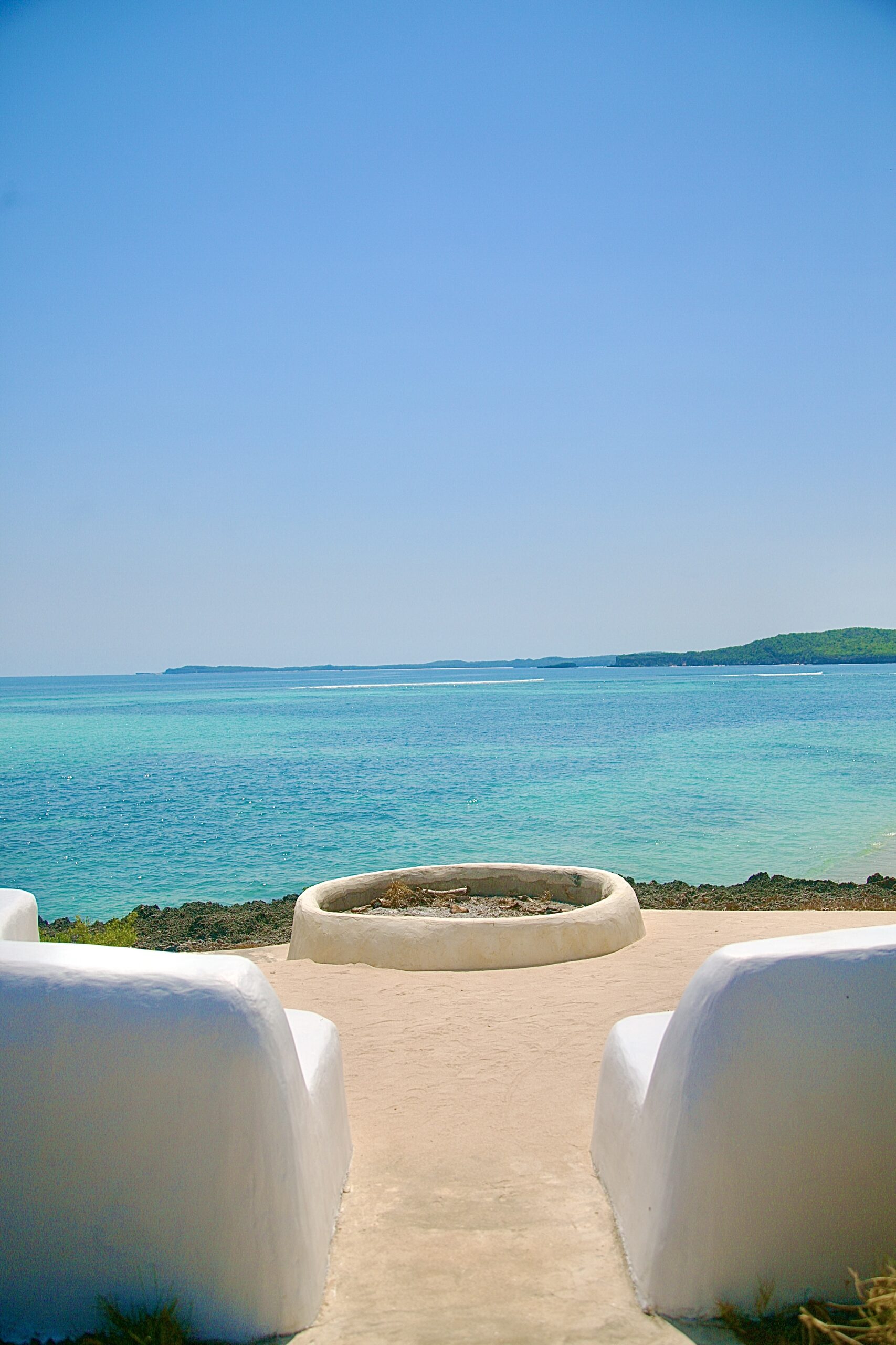 A water feature looking out to the sea and island